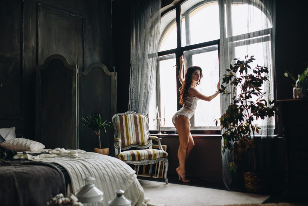 Woman Posing Near Window